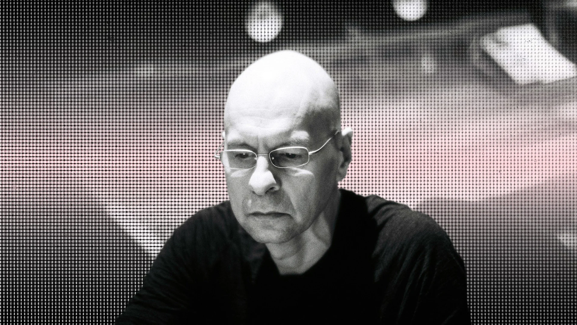 Gareth Jones working with a synthesizer in a studio setting.