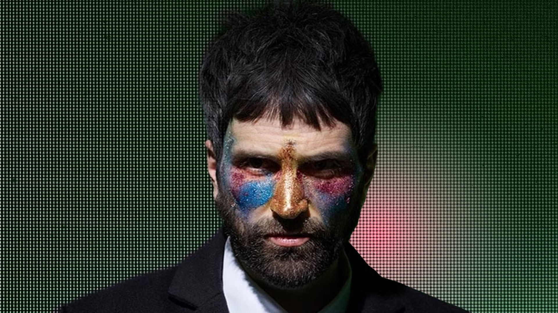 Serge Pizzorno with colorful face paint for GForce Software.