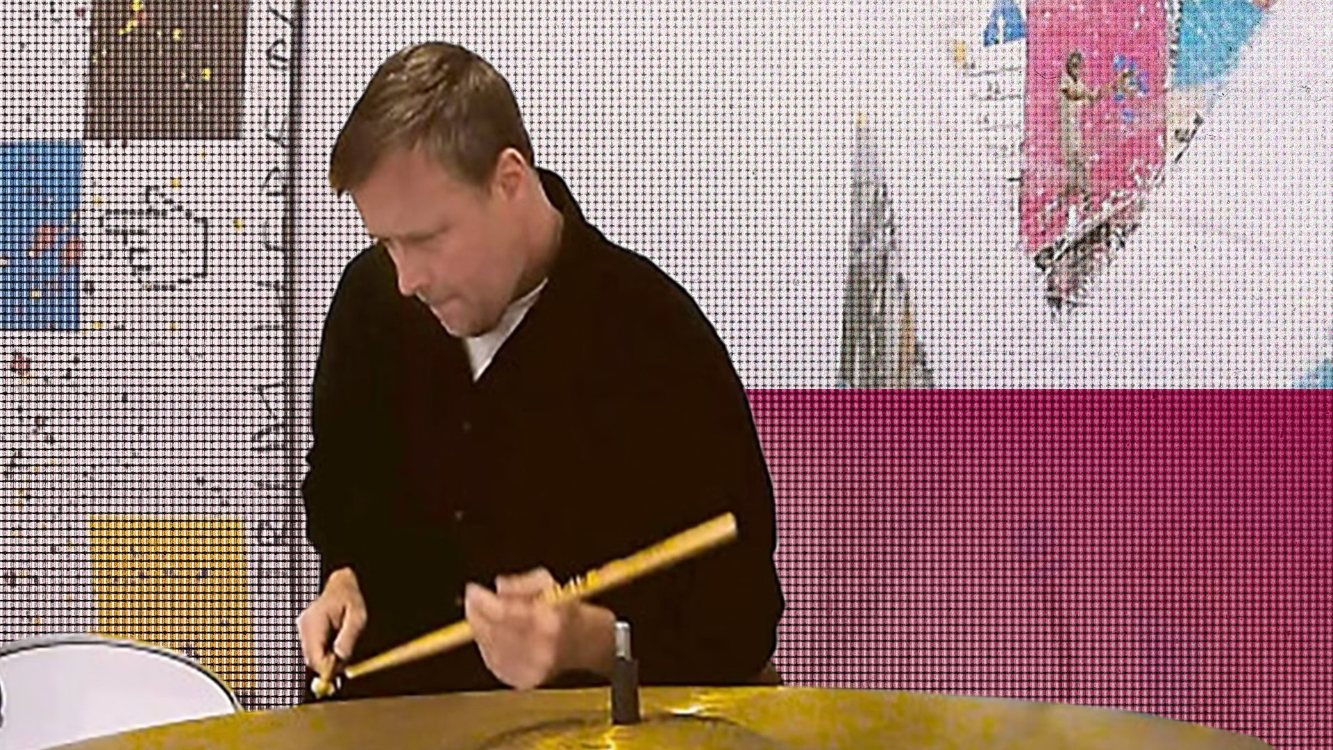 Brian Drake playing a flute during a musical performance or recording session.