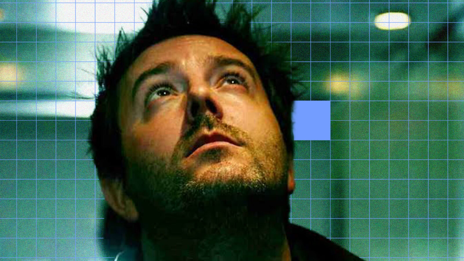 Close-up of a man with a grid overlay, focusing on sound design elements.