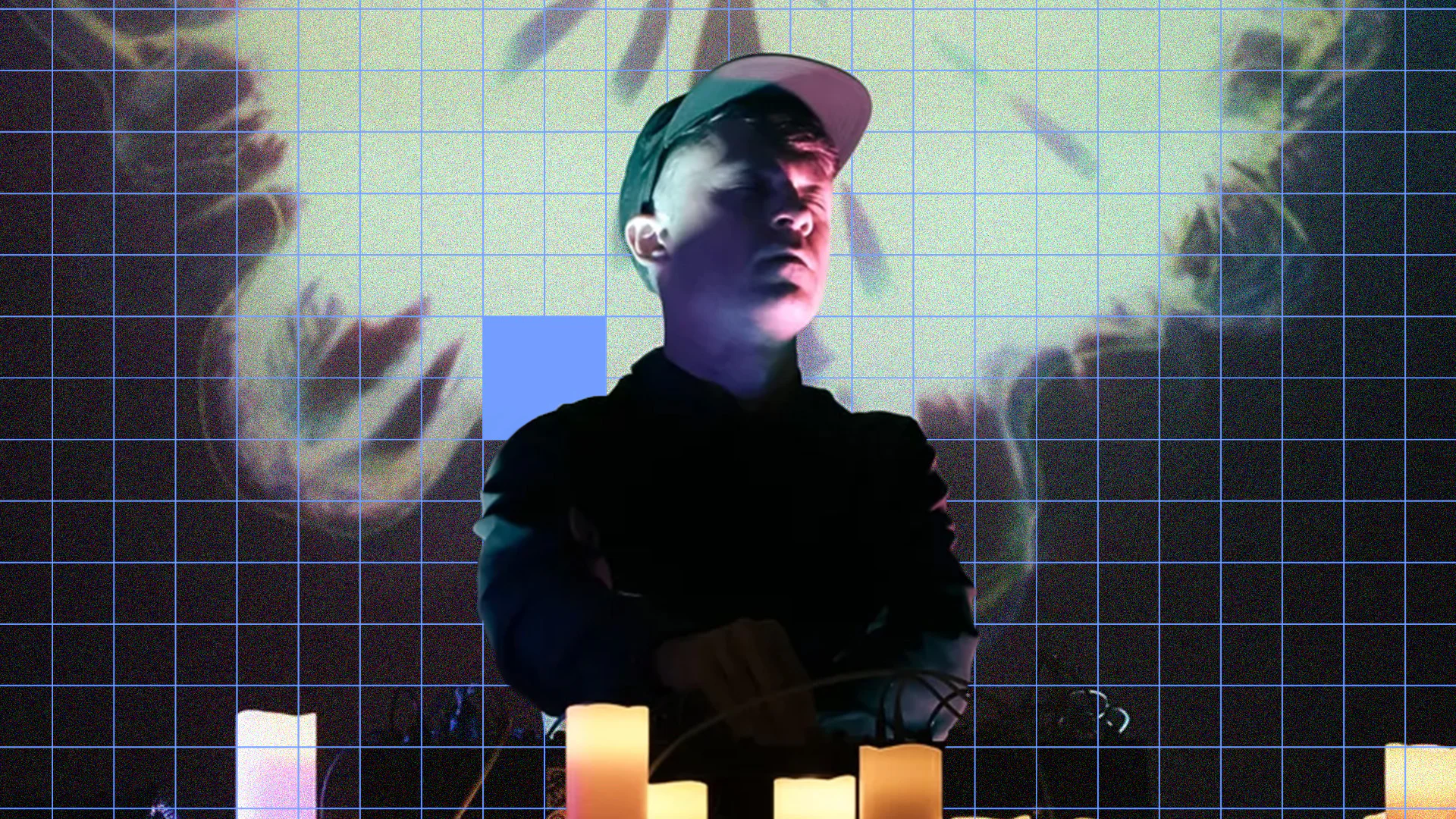 Person in front of a digital light and sound art display with grid pattern.