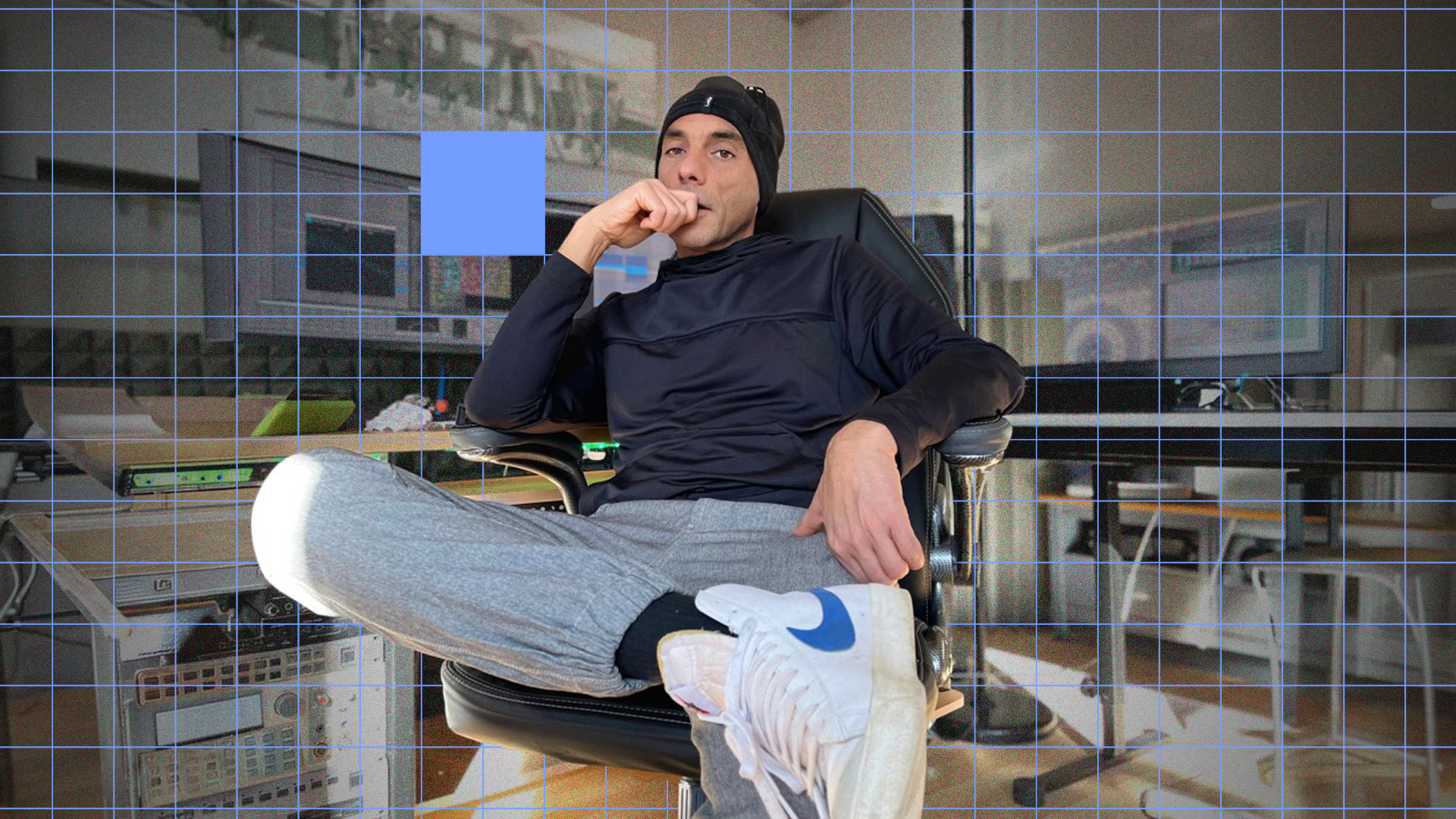Christian Laffitte sitting in a sound design studio with audio equipment.