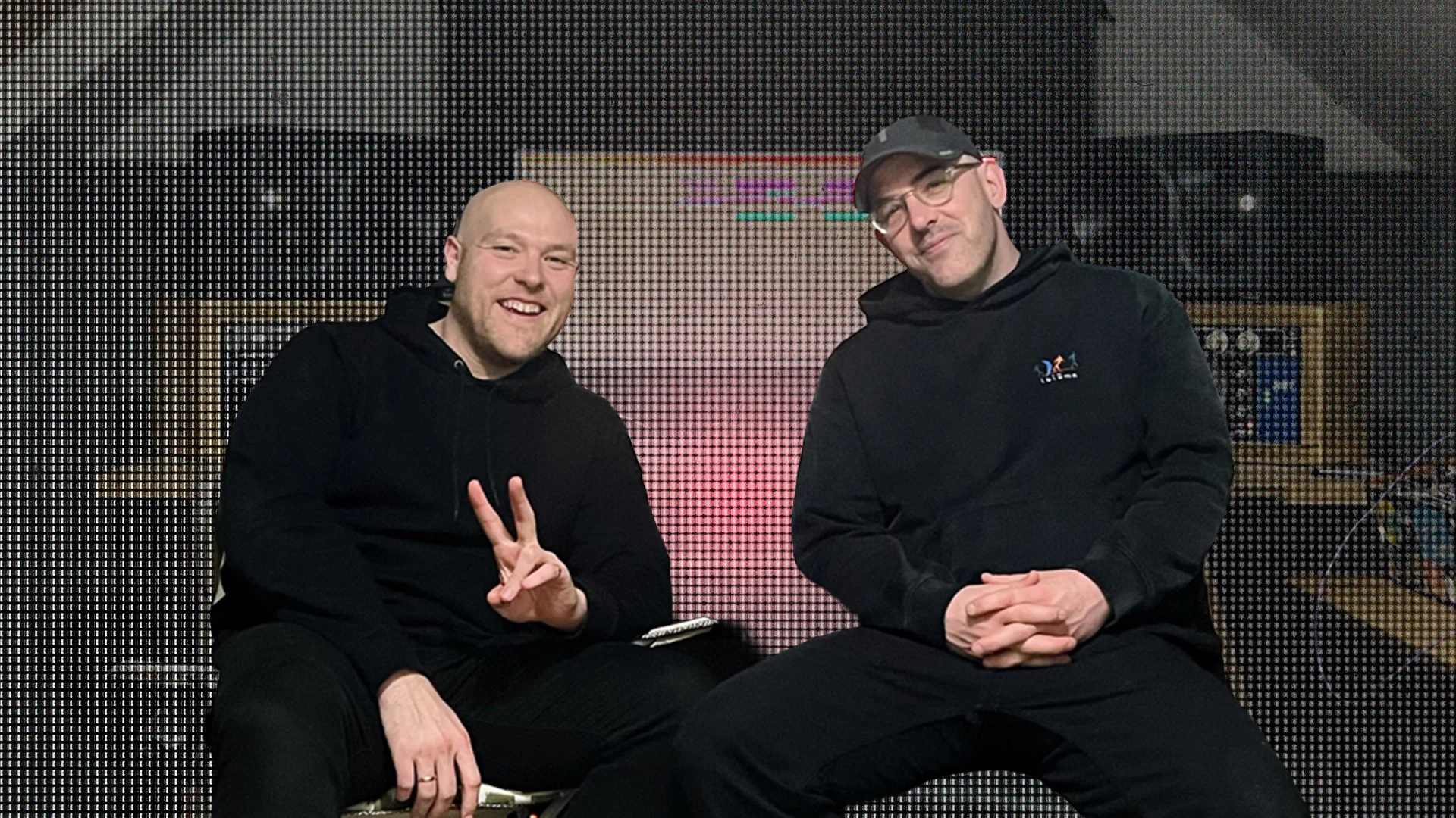 Mak & Pasteman sitting in a music studio, smiling and relaxed.